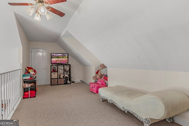 bedroom featuring carpet flooring, a textured ceiling, lofted ceiling, and ceiling fan