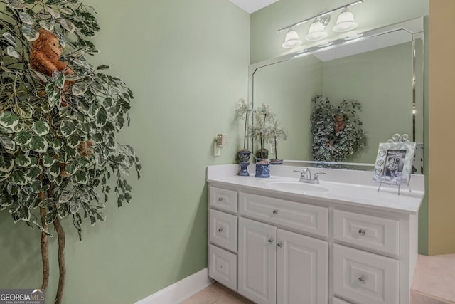 bathroom featuring tile patterned flooring and vanity