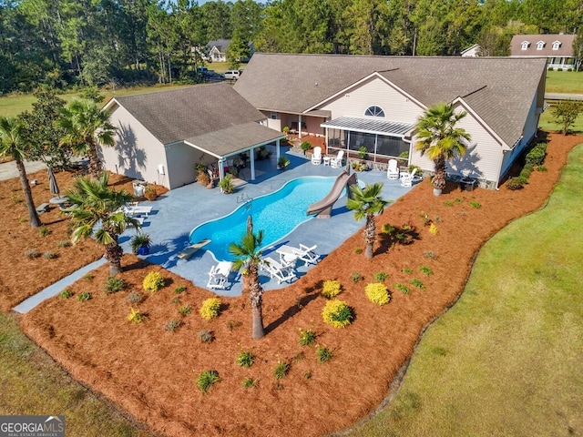 view of pool featuring a patio, a water slide, and a gazebo