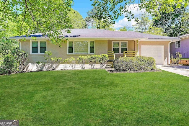 single story home with a front lawn and a garage