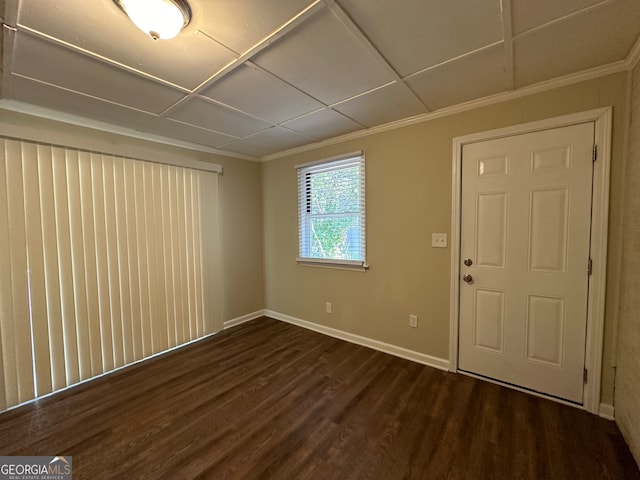 foyer featuring dark hardwood / wood-style flooring and crown molding