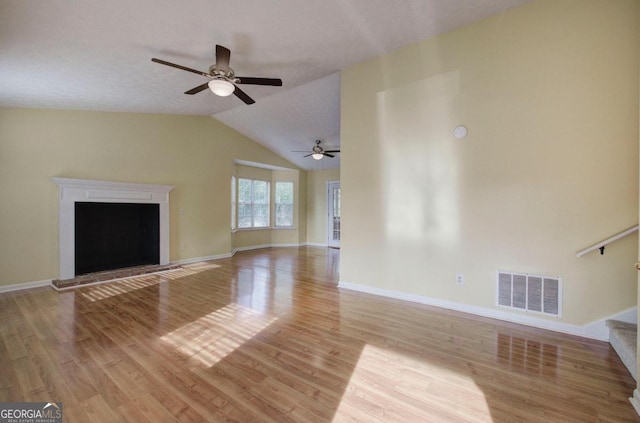 unfurnished living room featuring light hardwood / wood-style flooring, lofted ceiling, and ceiling fan