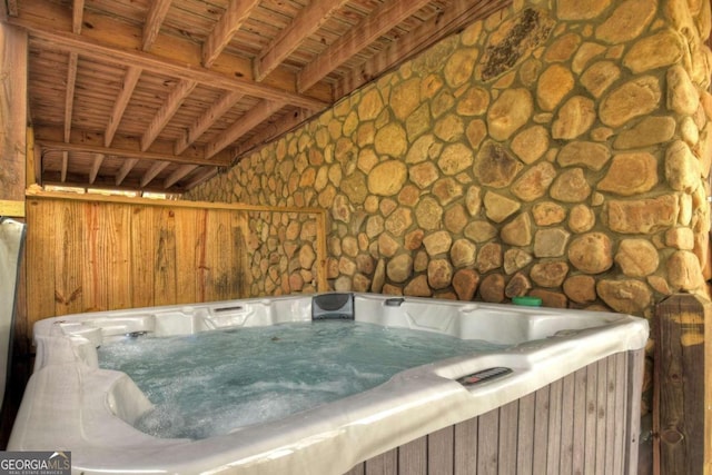 exterior space featuring a hot tub and wood ceiling