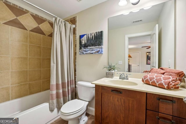 full bathroom featuring vanity, ceiling fan, toilet, and shower / bathtub combination with curtain