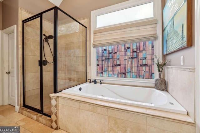 bathroom featuring tile patterned floors and shower with separate bathtub