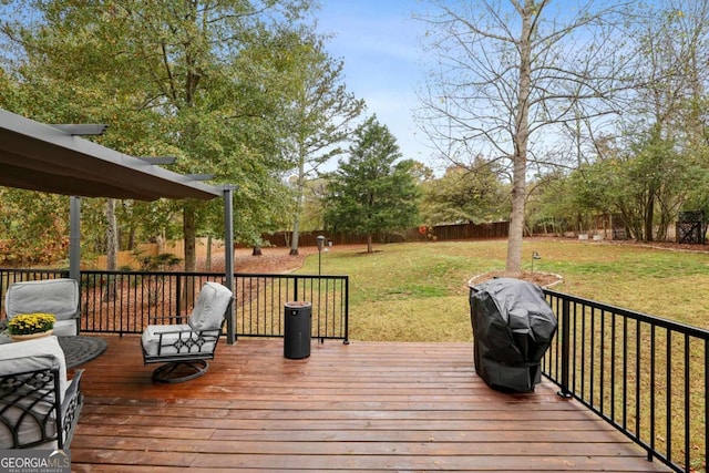 deck featuring a grill and a yard