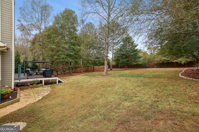 view of yard with a wooden deck