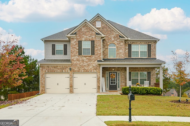 craftsman-style home with a garage and a front yard