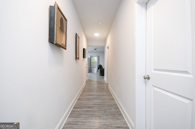 hall with light hardwood / wood-style floors