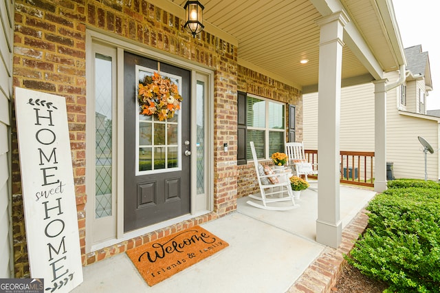 entrance to property with covered porch