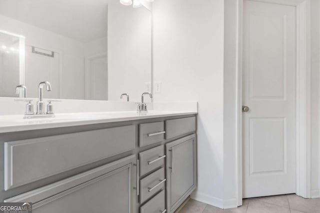 bathroom with vanity and tile patterned floors