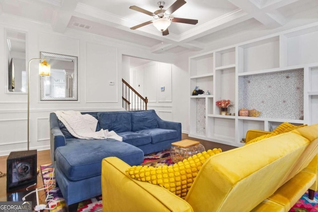 living room featuring beamed ceiling and coffered ceiling