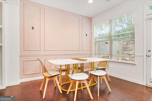 dining area with dark hardwood / wood-style floors