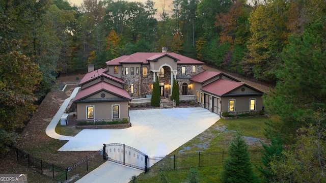 view of front of house with a garage and a yard