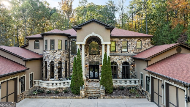 view of front of property featuring a garage and covered porch