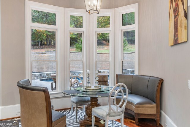 interior space with hardwood / wood-style flooring and a notable chandelier