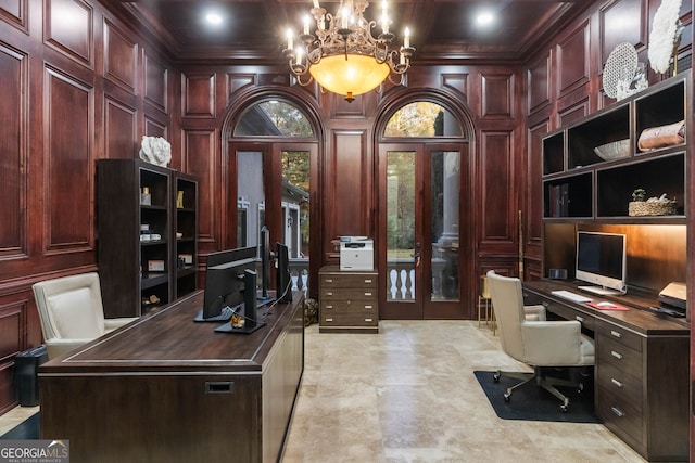 home office with wood walls, french doors, and crown molding