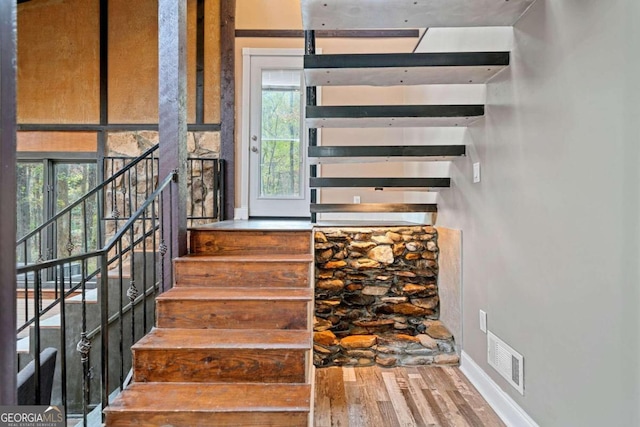 stairway with wood-type flooring