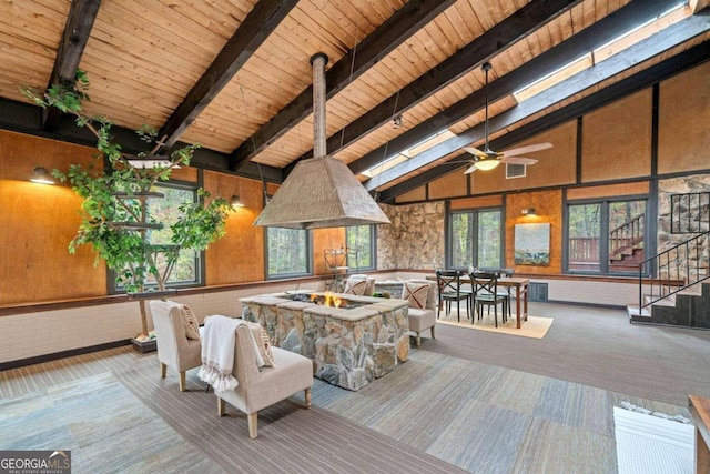 interior space with ceiling fan and an outdoor fire pit