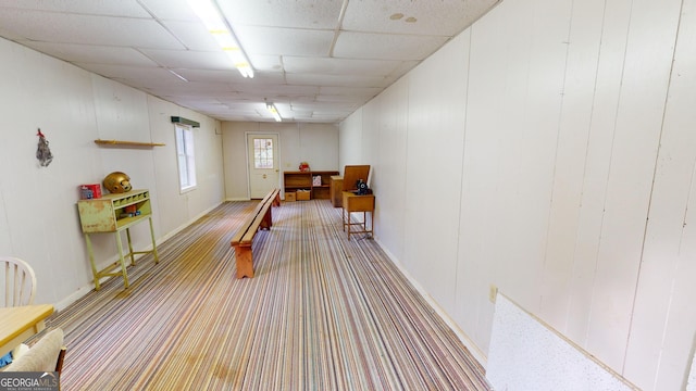 playroom featuring a paneled ceiling and bowling