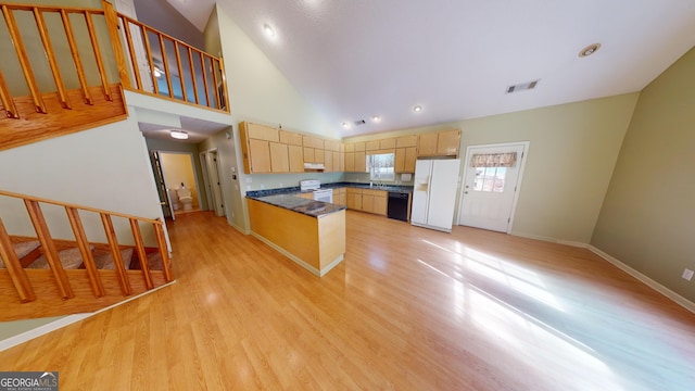 kitchen featuring sink, high vaulted ceiling, light wood-type flooring, light brown cabinetry, and white appliances