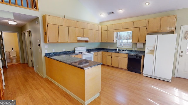 kitchen featuring kitchen peninsula, sink, white appliances, and light wood-type flooring