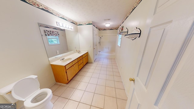 full bathroom with toilet, tile patterned floors, a textured ceiling, vanity, and bathing tub / shower combination