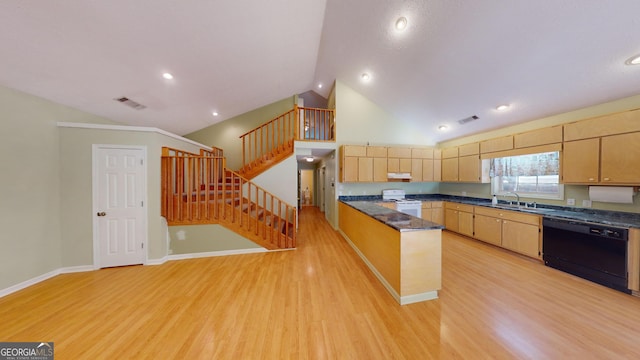 kitchen with white range oven, light hardwood / wood-style floors, vaulted ceiling, and black dishwasher