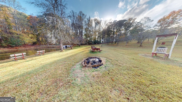 view of yard featuring a fire pit