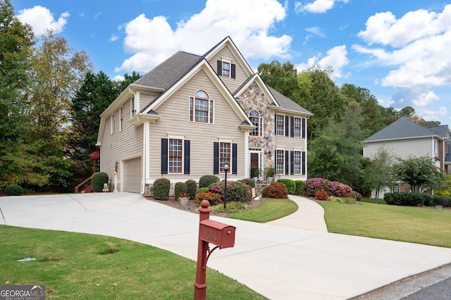 view of front facade with a front lawn and a garage