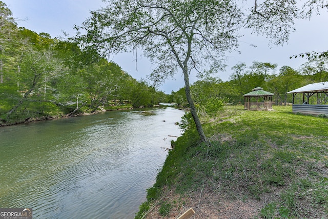 property view of water with a gazebo