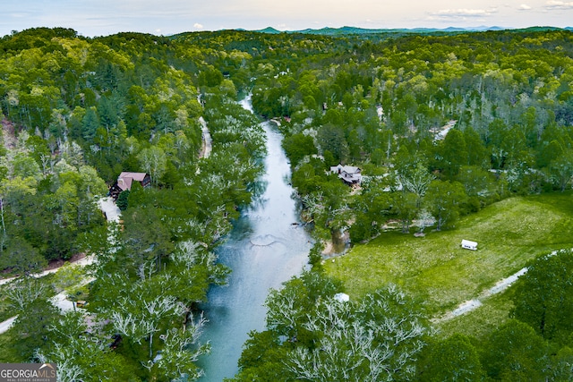 aerial view at dusk with a water view