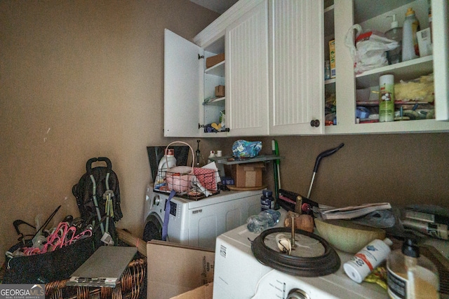 clothes washing area with washing machine and dryer