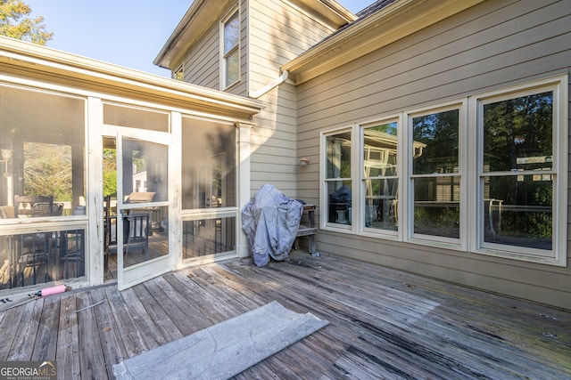 deck with a sunroom