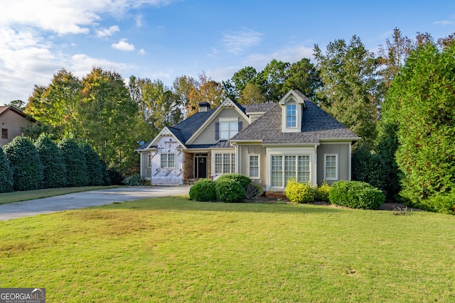 view of front facade with a garage and a front lawn