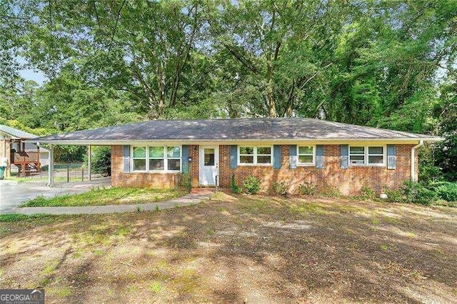 ranch-style home with a carport