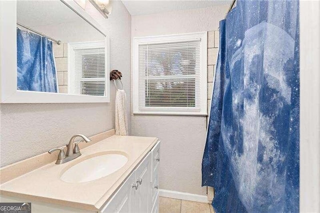 bathroom with vanity and tile patterned flooring