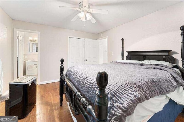 bedroom with ensuite bathroom, ceiling fan, a closet, and dark hardwood / wood-style flooring