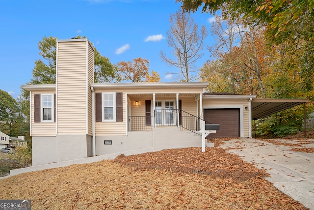 view of front facade with a garage and covered porch