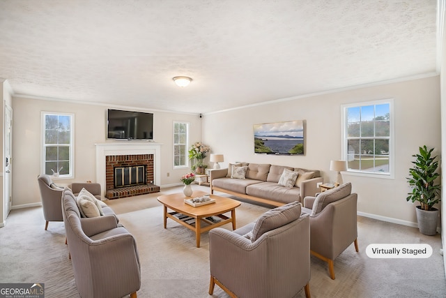 carpeted living room featuring a fireplace, a textured ceiling, ornamental molding, and plenty of natural light