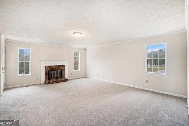 unfurnished living room with a brick fireplace, carpet floors, and a textured ceiling