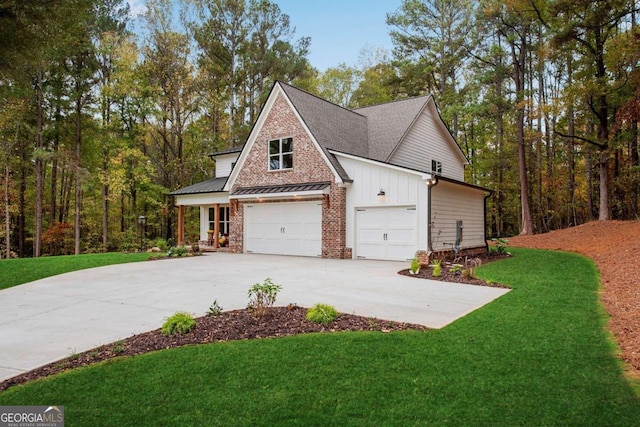 view of side of home with a lawn and a garage