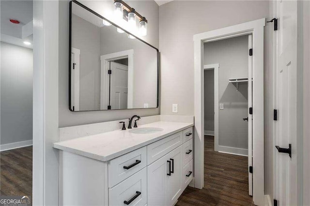 bathroom featuring vanity and wood-type flooring