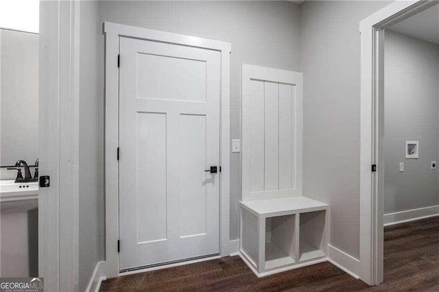 mudroom with dark wood-type flooring and sink