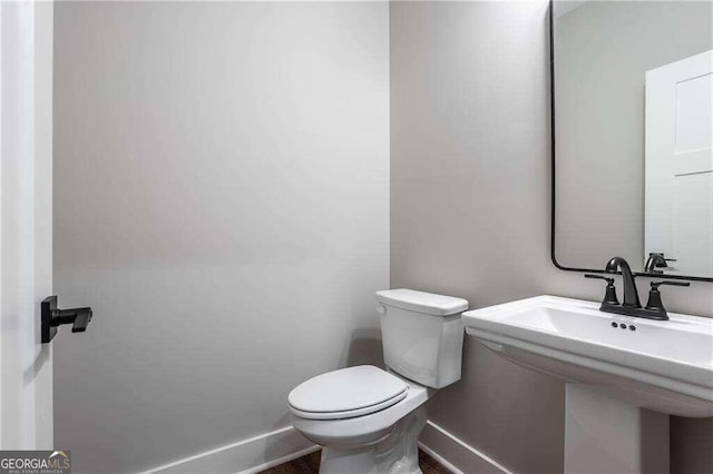 bathroom with toilet and sink