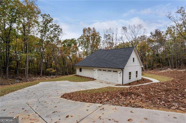 view of side of home with a garage