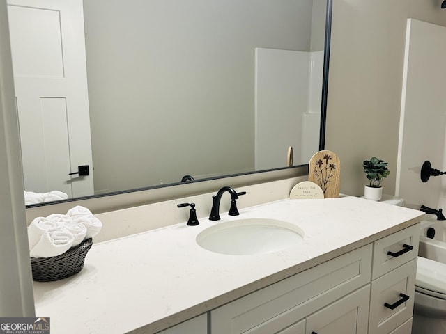 bathroom with vanity and toilet