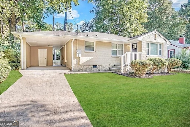 rear view of house featuring a yard and a carport