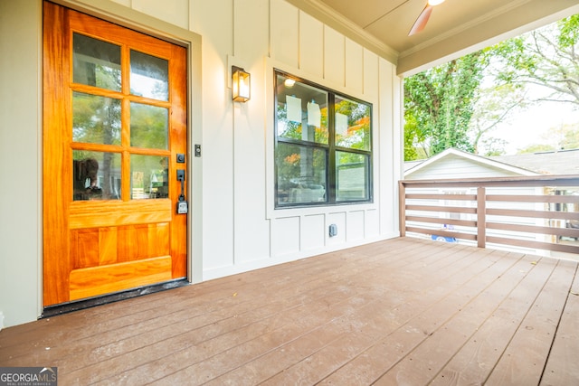 view of exterior entry with ceiling fan