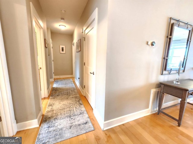 hallway featuring light hardwood / wood-style flooring